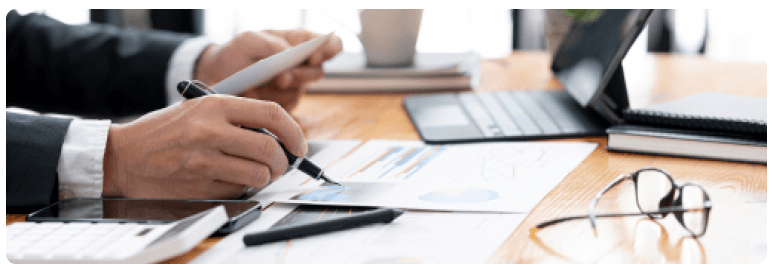Accountant reviewing financial documents at a desk